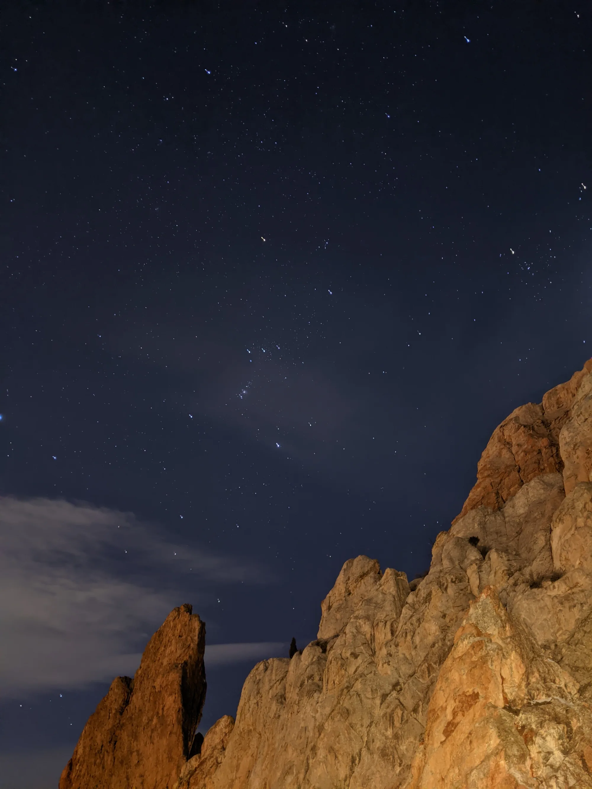 Stars over red rock formations in Colorado at night
